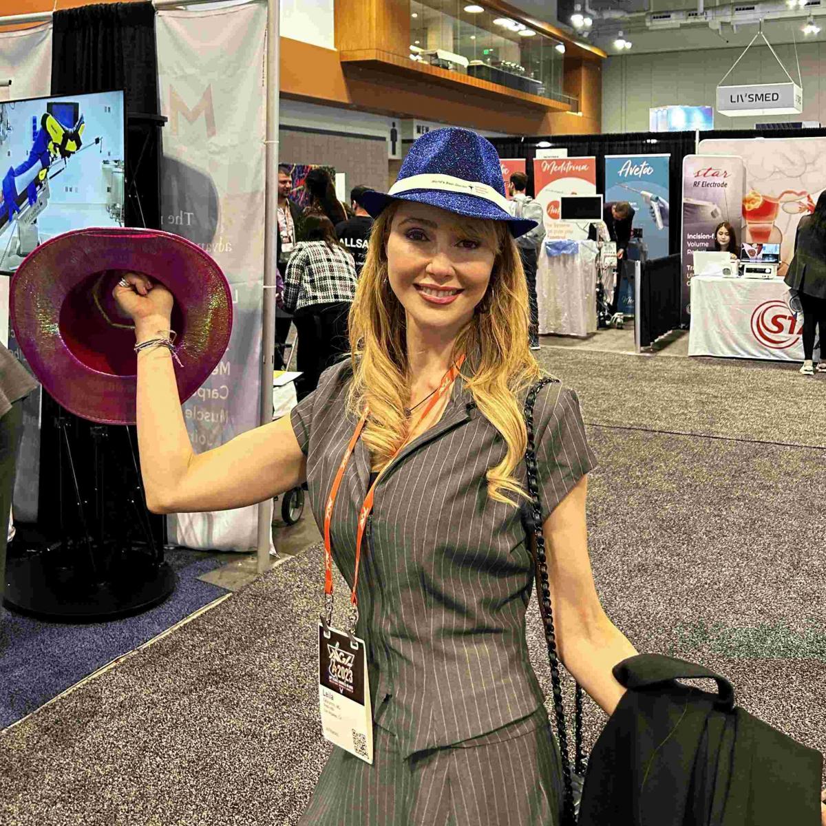 Advanced Endoscopy Devices at AAGL 2023 Photos Nashville - Woman with a hat and posing